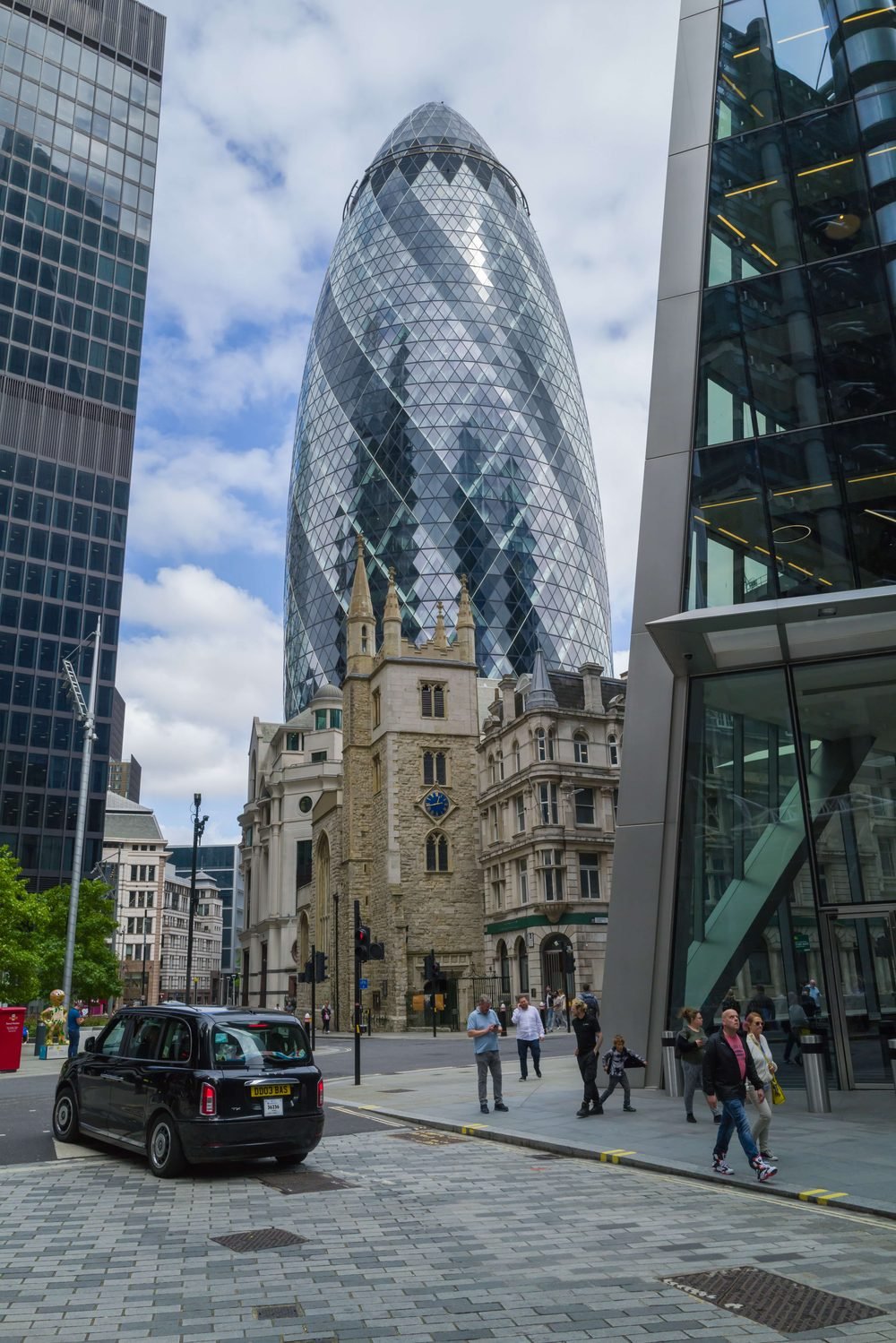The Gherkin tower on a London street